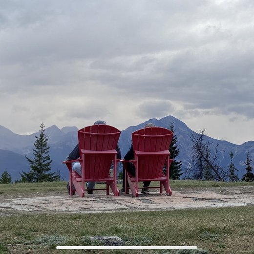Two chairs facing the mountains in the Canadian Rockies